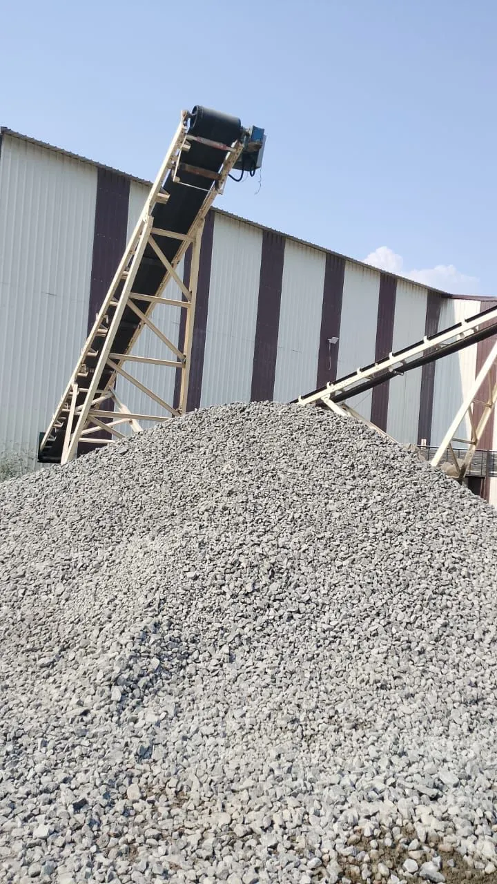 Coarse 40mm Crusher Jally aggregate being discharged from conveyor with dust at Tirupati Balaji Blue Metals LLP plant, Tamil Nadu